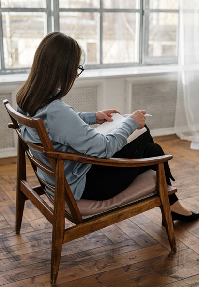 Picture of woman writing on notebook